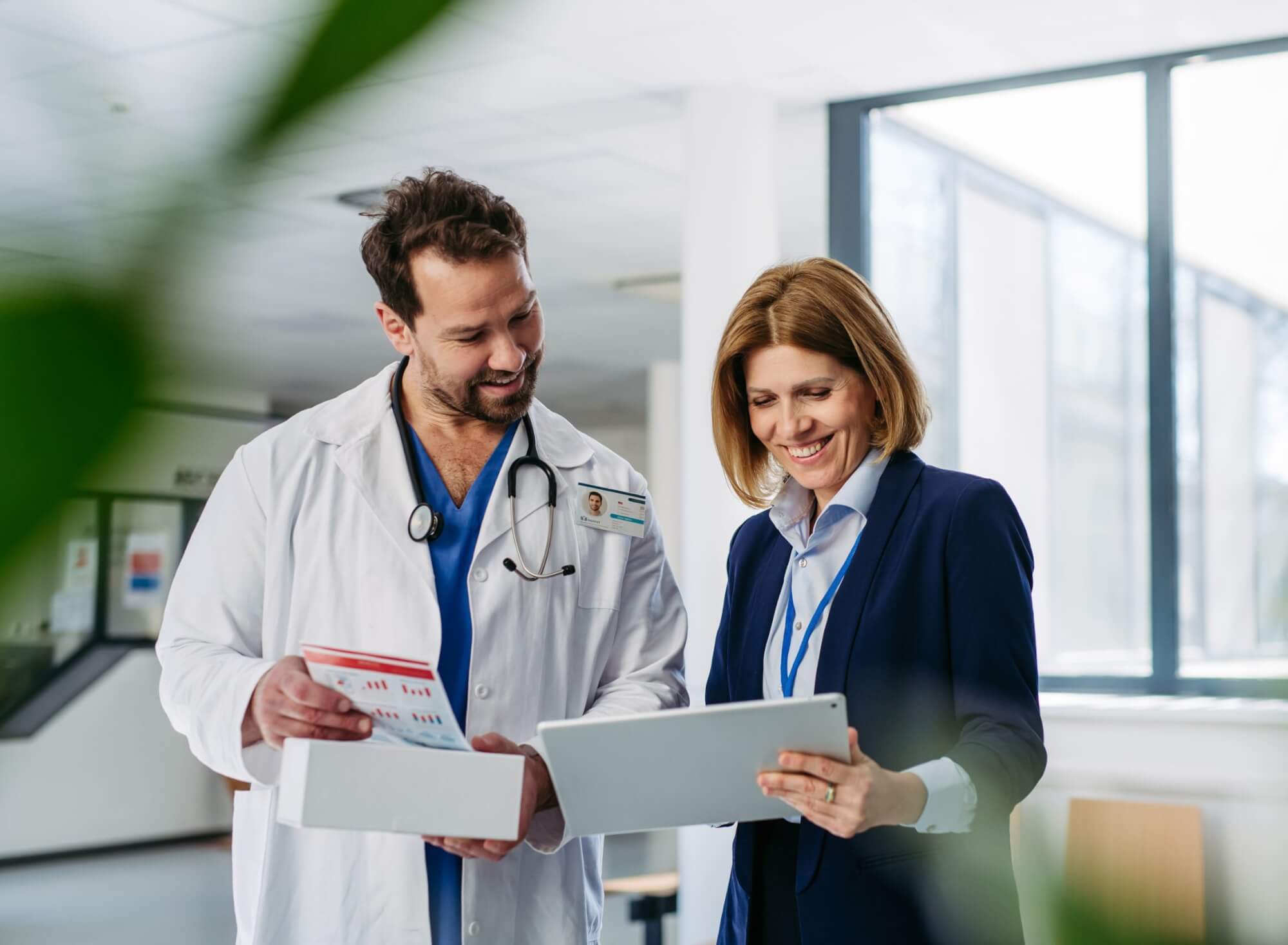 Doctor and patient reviewing digital service information